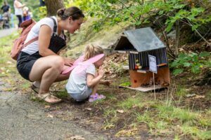 Mother and daughter looking at a fairy house