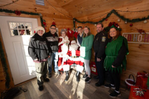 Adult residents pose with Santa